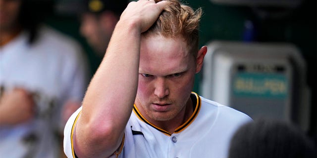 Mitch Keller walks in the dugout