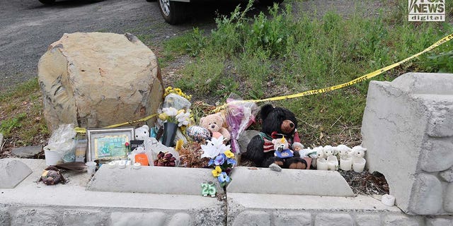 A makeshift memorial outside of 1122 King Road