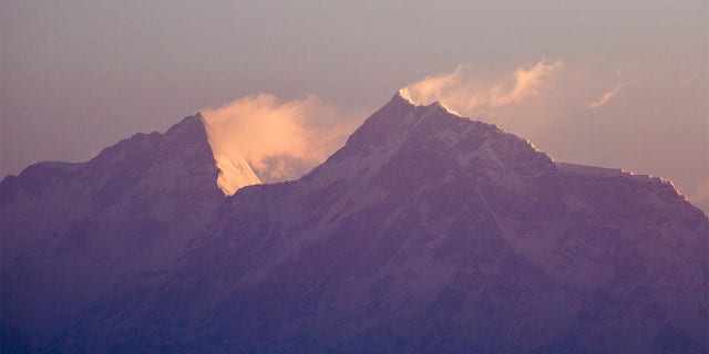 Snow blows off of Mount Manaslu