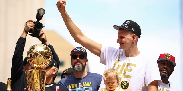 Nikola Jokic celebrates at a parade
