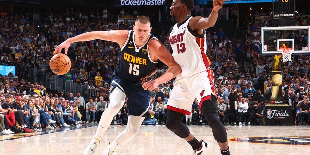 Nikola Jokic dribbles the ball