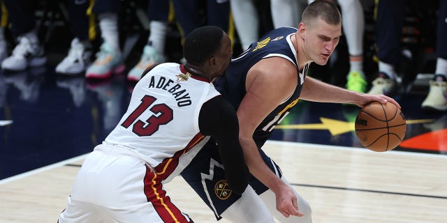 Nikola Jokic backs down Bam Adebayo