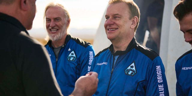 U.K. billionaire Hamish Harding receives a pin after traveling to space on a Blue Origin flight