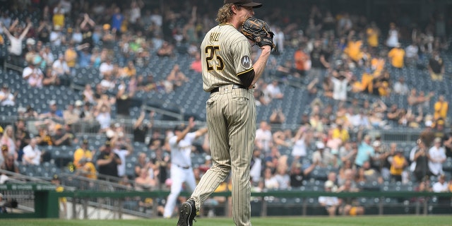 Tim Hill reacts after a throwing error