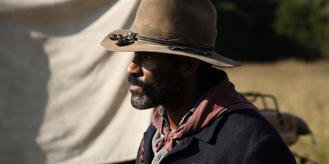 A side profile of LaMonica Garrett wearing a cowboy hat