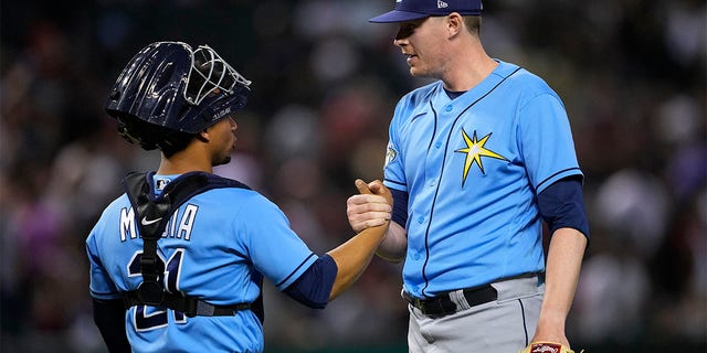 Pete Fairbanks celebrates with Francisco Mejia