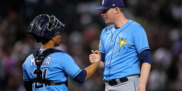 Pete Fairbanks celebrates with Francisco Mejia