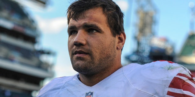 Peyton Hillis walks off the field