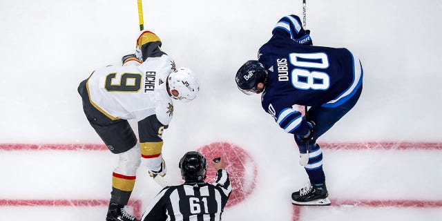 Jack Eichel and Pierre-Luc Dubois get ready for faceoff