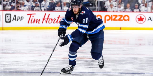 Pierre-Luc Dubois plays puck
