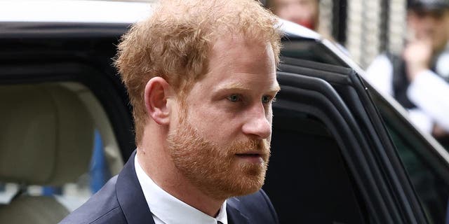 Prince Harry gets out of car at court