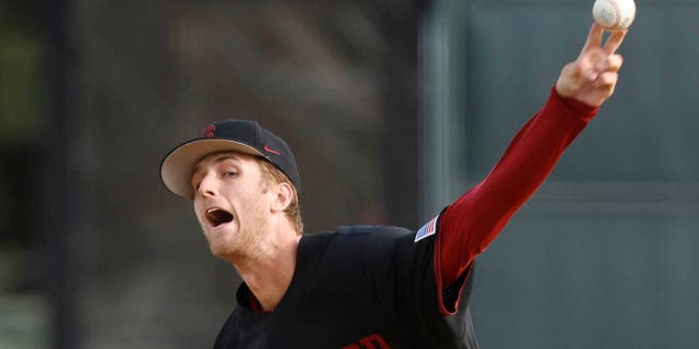 Quinn Mathews throws a pitch