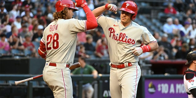 JT Realmuto celebrates with Alec Bohm
