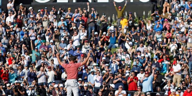Jon Rahm celebrates at Riviera