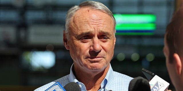 Rob Manfred in front of microphones