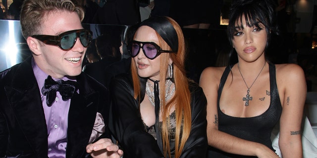 Madonna and her kids at the Tom Ford fashion show