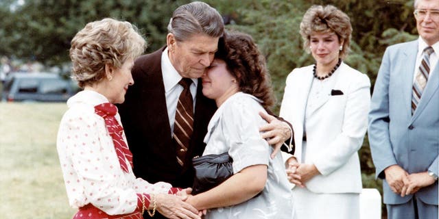 Ronald Reagan comforting supporting