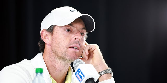 Rory McIlroy answers questions at the podium