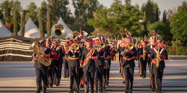 A band in Jordan playing outdoors during the royal wedding