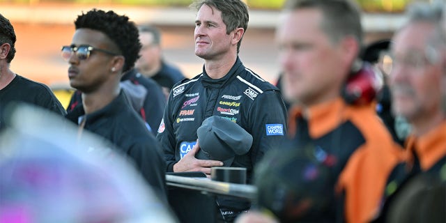 Ryan Hunter-Reay listens to the national anthem