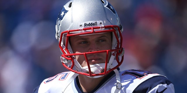 Ryan Mallet wearing a Patriots helmet