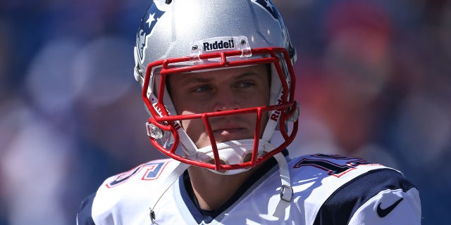 Ryan Mallet with Patriots helmet on