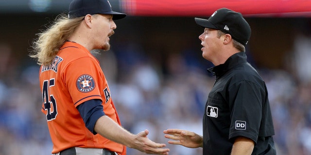 Ryne Stanek argues a balk call
