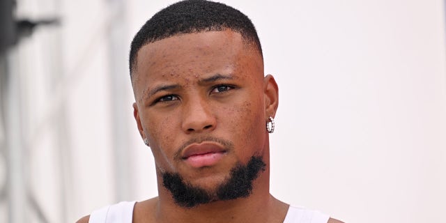 Saquon Barkley looks on