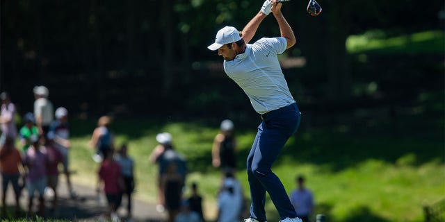 Scottie Scheffler tees off