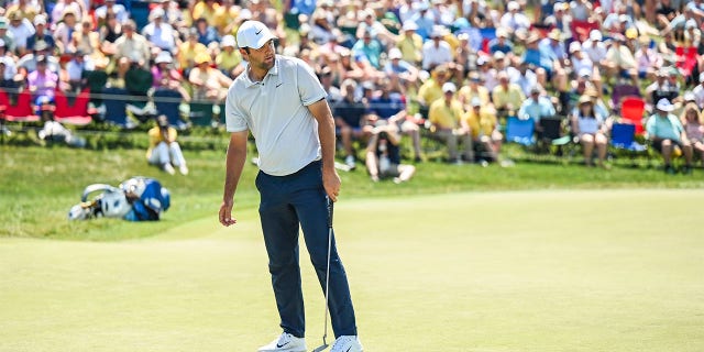 Scottie Scheffler reacts to missed putt