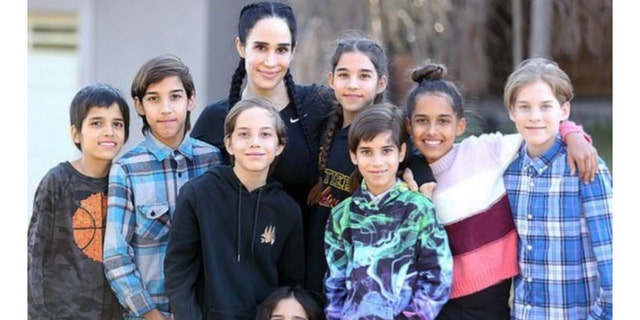 Nadya Suleman, known as Octomom poses with her octuplets in a family photo