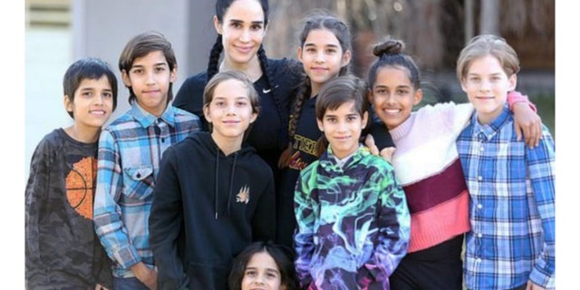 Nadya Suleman, known as Octomom poses with her octuplets in a family photo