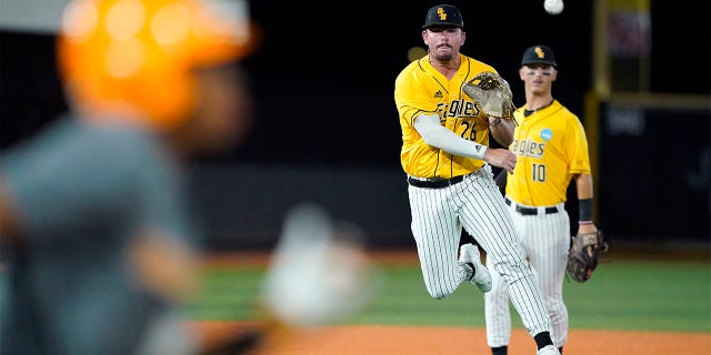 Danny Lynch throws to first