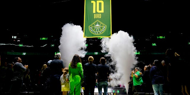 Sue Bird watches with family