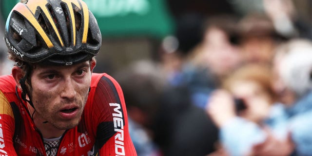 Gino Mader reacts to crossing finish line