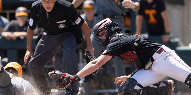 Zane Denton dives into home plate