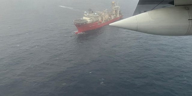 Aerial photo from a USCG plane showing a search vessel at sea