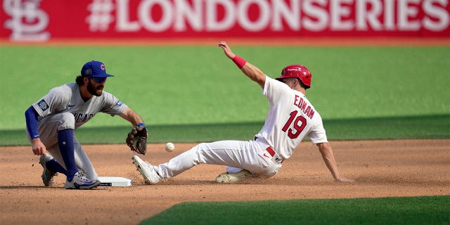Tommy Edman slides into second base
