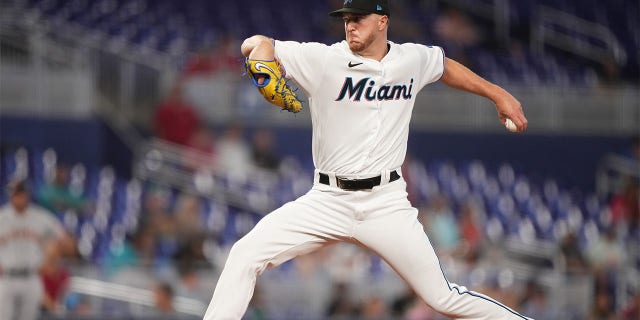 Trevor Rogers throws pitch