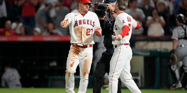 Mike Trout celebrates with Mickey Moniak