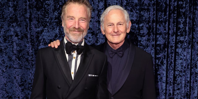 Victor Garber and his husband at Clive Davis' 90th Birthday