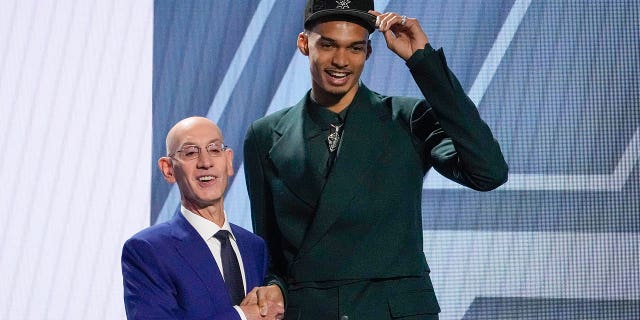 Victor Wembanyama and NBA commissioner Adam Silver