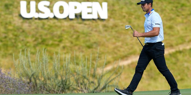 Viktor Hovland walks the course