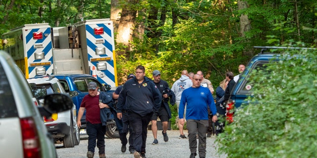 Search and rescue teams walk away from scene