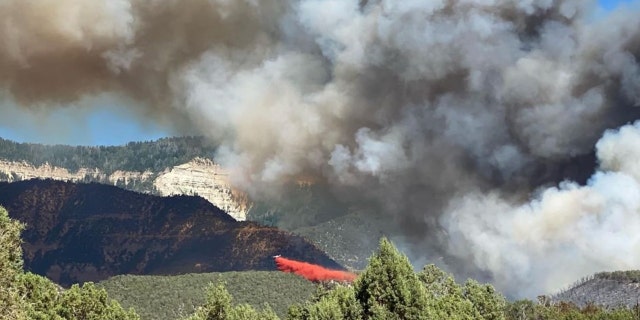 Retardant falls on the Spring Creek Fire