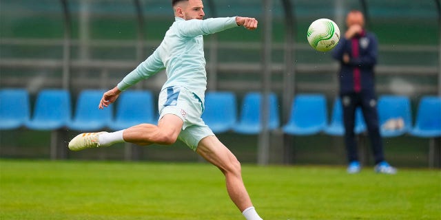 Declan Rice kicks soccer ball