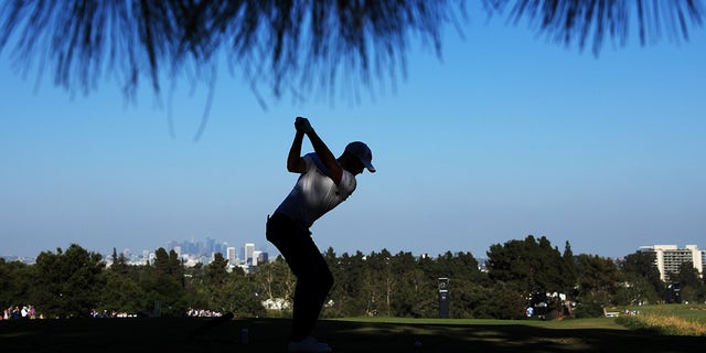 Wyndham Clark swings club