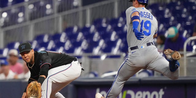 Michael Massey is thrown out at first base