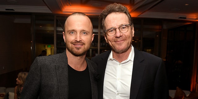Aaron Paul and Bryan Cranston smile at a Breaking Bad event
