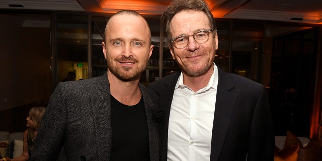 Aaron Paul and Bryan Cranston smile at a Breaking Bad event